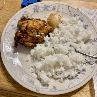 chicken adobo plated with rice